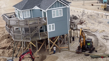 Ocean Battle: Crews rush to save North Carolina Outer Banks home from collapsing into the Atlantic