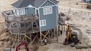 Ocean battle: Crews rush to save North Carolina Outer Banks home from collapsing into the Atlantic