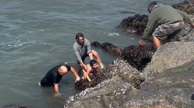Video: Father and daughter heroically rescued by swim coach in rip current in California