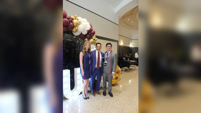 FOX Weather’s Craig Herrera presents the very first graduation cords to Sadie Morris and Mark Kimoto at the 2026 Mississippi State University symposium.