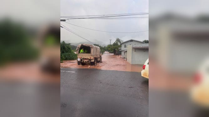 Honolulu Fire Department drives through floodwaters while responding to emergencies.