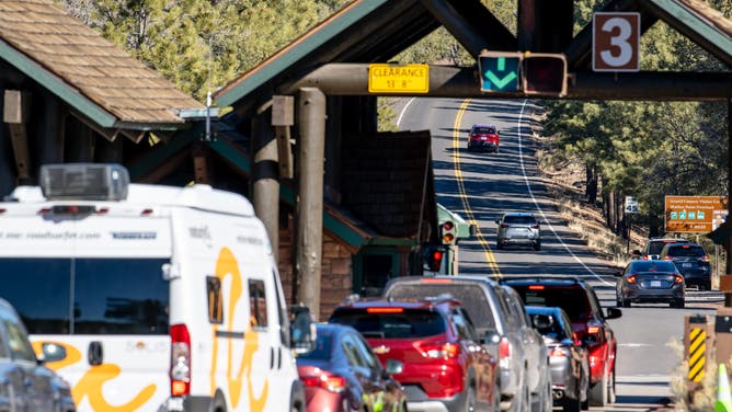 Vehicles wait in line at an entrance to the Grand Canyon National Park on February 23, 2025 in Grand Canyon, Arizona.