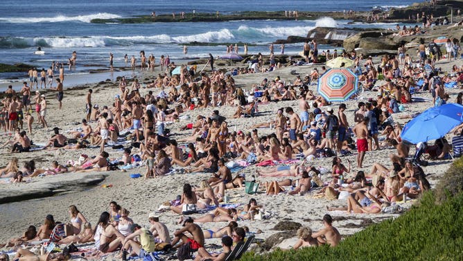 SAN DIEGO, CALIFORNIA - JANUARY 31: Beachgoers pack La Jolla's Windansea Beach during a winter heat wave on January 31, 2026 in San Diego, CA. 