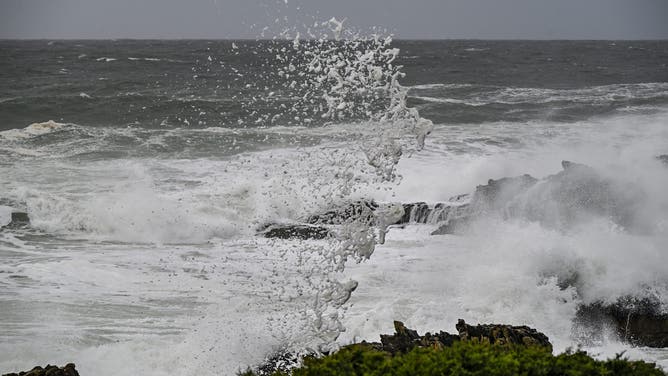 CASCAIS, PORTUGAL - FEBRUARY 13: Foam is produced by heavy winds and large waves breaking into the rocks near Cabo Raso Lighthouse on February 13, 2026 in Cascais, Portugal. Bad weather continues to batter most regions of Portugal with strong winds, heavy rain, and rough seas. The entire mainland is currently under a yellow warning. Trains and boats have been suspended, schools and universities closed, businesses suspended, and residents displaced. The death toll related to the storms ravaging the country now stands at 16, and thousands of people are still without power.