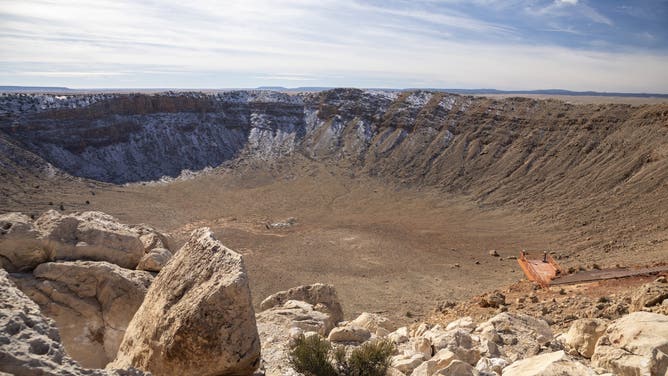 Winslow, Arizona, Meteor Crater. The crater was formed about 50,000 years ago. It is 560 feet deep and about three-quarters of a mile in diameter. It is now a major tourist attraction.