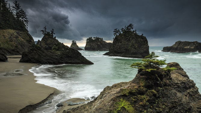 Long exposure shot as rain begins to fall at Secret Beach in Oregon's Samuel H. Boardman State Scenic Corridor
