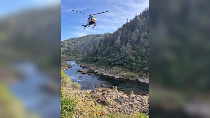 A helicopter is used to hoist an injured hiker out of a California canyon on Sunday.