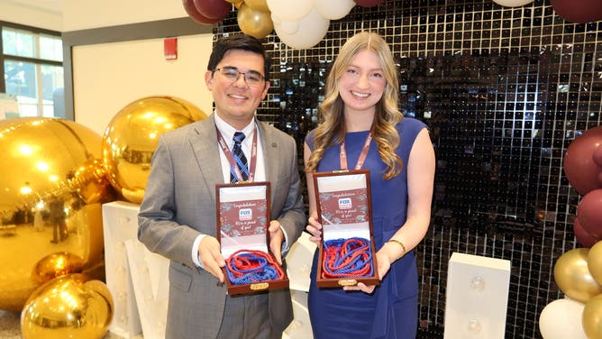 Sadie Morris and Mark Kimoto receive graduation cords at the 2026 Mississippi State University symposium.