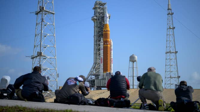 Media aim their remote cameras on NASA’s Artemis II Space Launch System (SLS) rocket and Orion spacecraft, atop a mobile launcher at Launch Complex 39B, Sunday, March 29, 2026, at NASA’s Kennedy Space Center in Florida.