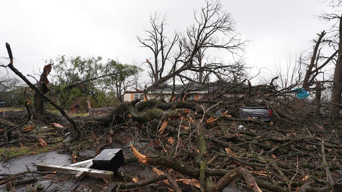 Photos from the ground in Aroma Park, Illinois, on March 12 capture the devastating destruction in Kankakee County after a tornado ripped through March 10