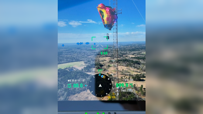 Crews rescue two passengers after a hot air balloon crashed into 920-foot Texas cell tower on Feb. 28.