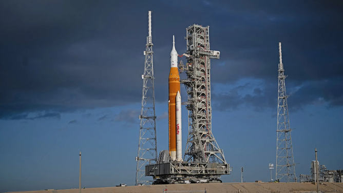 NASA’s SLS (Space Launch System) rocket and Orion spacecraft, secured to the mobile launcher, are seen as they arrive at the Launch Pad 39B, Friday, March 20, 2026, at NASA’s Kennedy Space Center in Florida.