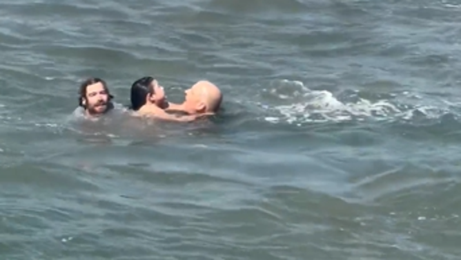 Local swimming coach Lucas Taub reaches a father and daughter struggling in rip currents in California.