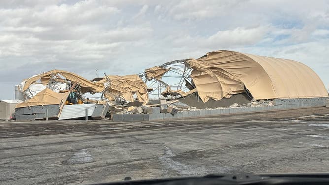 Wind shreds salt shed in Livingston, Wyoming Thursday.