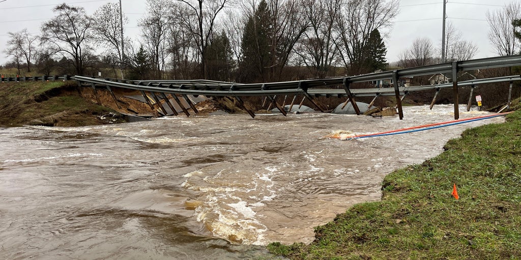 Popular Michigan bridge destroyed as river hits historic flood level