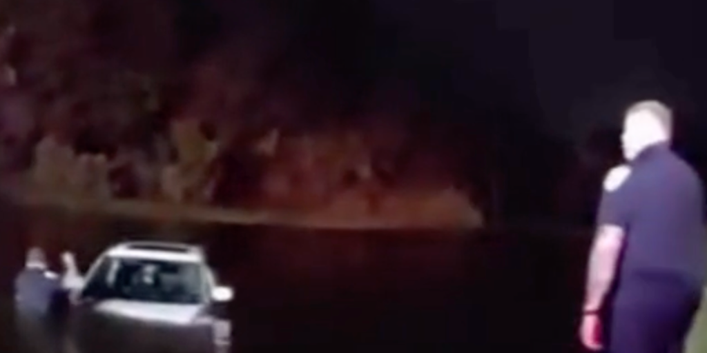 Watch: Elderly couple rescued after vehicle slides into pond during heavy downpours in Port St. Lucie