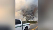 Progress made on containing massive wildfires in Florida, Georgia as rain moves in over areas in the South