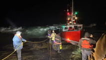 2 rescued in multiagency effort after fishing boat slammed aground by waves in Massachusetts