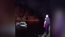Watch: Elderly couple rescued after vehicle slides into pond during heavy downpours in Port St. Lucie