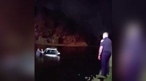 Watch: Elderly couple rescued after vehicle slides into pond during heavy downpours in Port St. Lucie