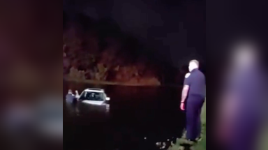 Watch: Elderly couple rescued after vehicle slides into pond during heavy downpours in Port St. Lucie