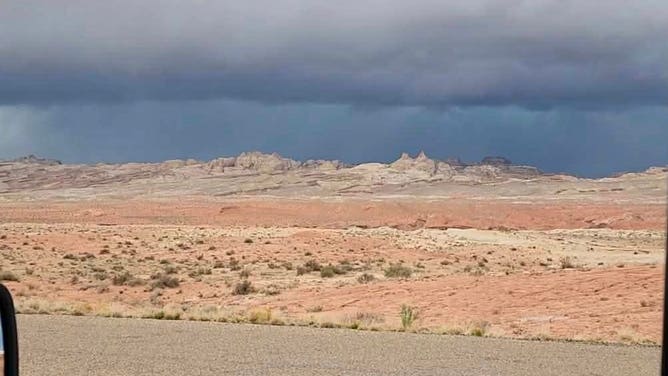 Dark storm clouds loom at Goblin Valley State Park in Utah.
