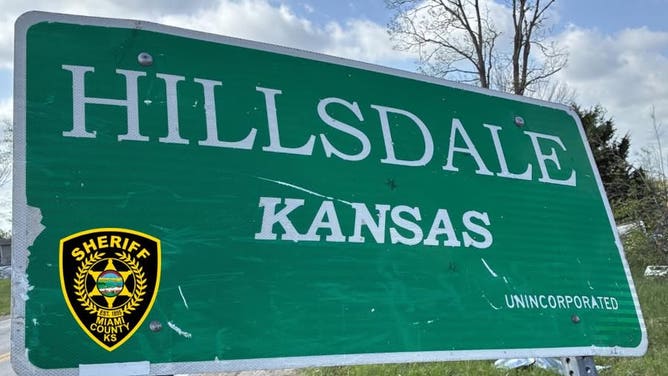 Hillsdale, Kansas welcome sign damaged by tornado-warned storm.
