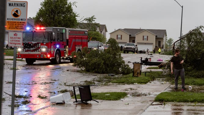 A fire truck responds to reported tornado damage in Belton, Missouri.