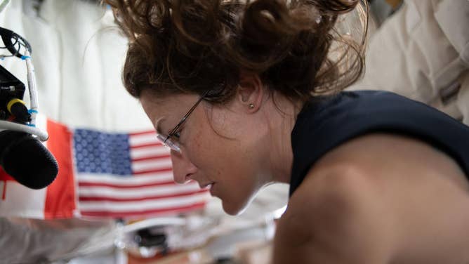 NASA astronaut and Artemis II mission specialist Christina Koch, seen here on the fourth day of the mission, prepping for lunar flyby activities after completing aerobic exercise on the flywheel device.