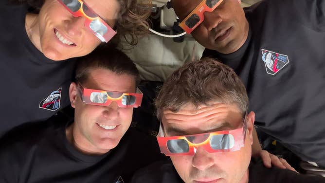 April 6, 2026) – The Artemis II crew – Mission Specialist Christina Koch (top left), Mission Specialist Jeremy Hansen (bottom left), Commander Reid Wiseman (bottom right), and Pilot Victor Glover (top right) – uses eclipse viewers, identical to what NASA produced for the 2023 annular eclipse and 2024 total solar eclipse, to protect their eyes at key moments during the solar eclipse they experienced during their lunar flyby. This was the first use of eclipse glasses at the Moon to safely view a solar eclipse.