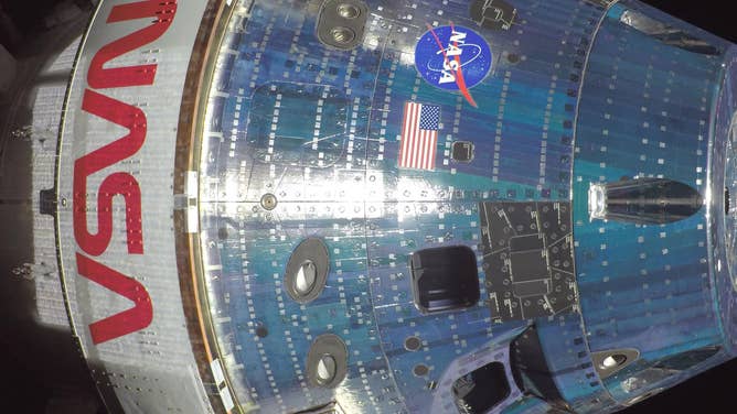 (April 7, 2026) - NASA’s Orion spacecraft is pictured here from one of the cameras mounted on its solar array wings. At the time this photo was taken at 8:33 a.m. ET, the Artemis II crew was in a sleep period ahead of beginning their seventh day into the mission.