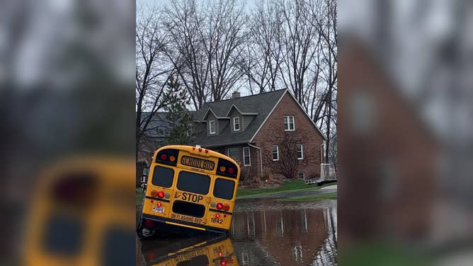Suamico Fire Department rescued a driver from a school bus amid rising floodwaters in Wisconsin on Tuesday, April 14