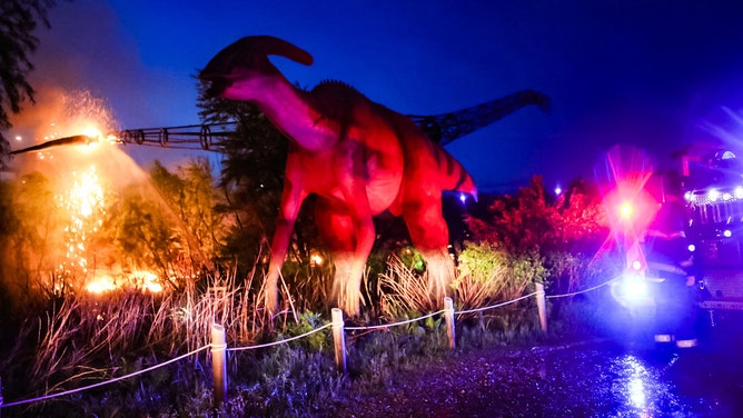 As severe storms tore through Kansas Saturday night, a powerful lightning strike ignited a massive animatronic Sauroposeidon at Field Station: Dinosaurs, engulfing the structure in flames.
