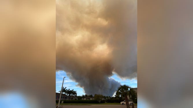 Smoke covers the sun in Naples Florida on Monday, April 13, amid a brush fire that broke out near I-75 in Collier County