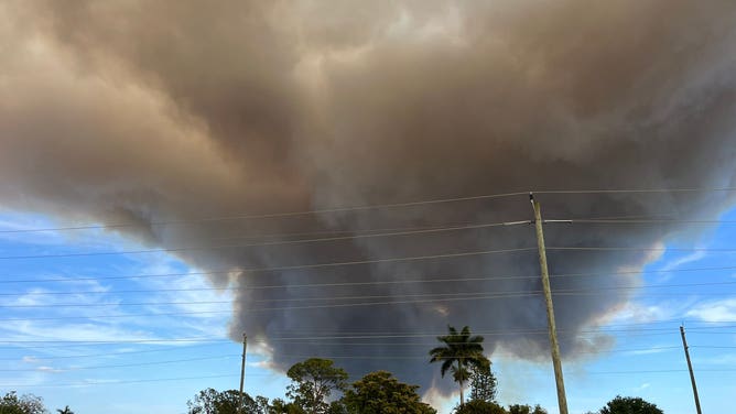 Smoke covers the sun in Naples Florida on Monday, April 13, amid a brush fire that broke out near I-75 in Collier County