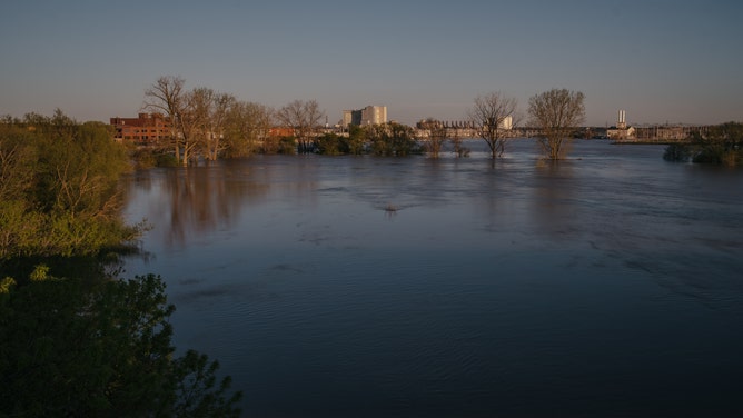 Flood waters from the Tittabawassee River surround the Dow Inc. facility after dams failed in Midland, Michigan, U.S., on Wednesday, May 20, 2020. President Donald Trump said he's sending federal emergency workers to Midland, where dam failures have flooded a Dow chemical complex and homes in a disaster that may force the evacuation of more than 10,000 people.