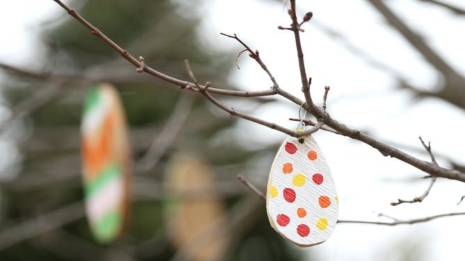 ACTON, MASSACHUSETTS - APRIL 10: A decorated egg is displayed in a yard as part of the non-denominational social distancing egg hunt on April 10, 2020 in Acton, Massachusetts.
