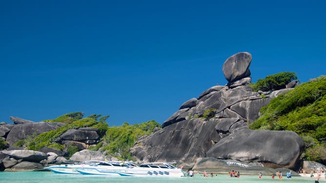 Donald Duck Beach on the Similan Islands. The islands are renowned among divers for their rich coral reefs, clear waters and pristine beaches. The best diving months are between December and May when the weather is fine and underwater visibility at its best. The Similans offer over 200 species of hard coral, many more soft corals, hundreds of colourful fish species, and tens of thousands of other marine organisms which make their homes on the reefs. 