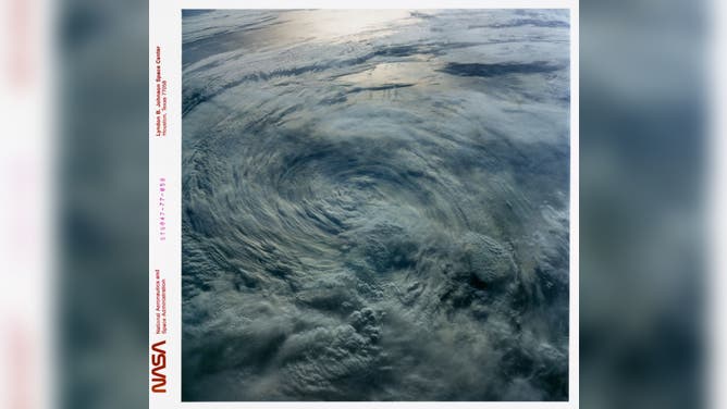 Tropical Storm Iniki over the North Pacific, dissipating from hurricane status when this photo was taken from the Space Shuttle Endeavour during mission STS-47, 12th to 20th September 1992. Two days prior, as a full fledged hurricane, with winds of about 150 mph and waves of over 15 ft., it swept over the Hawaiian island of Kauai, but as Iniki moved over the colder waters of the North Pacific, it began to weaken as can be seen by the lack of a tight spiral gyre and the absence of an eye in the center. 