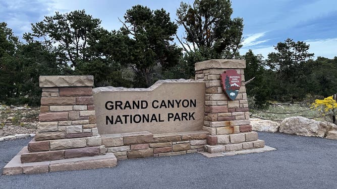GRAND CANYON NATIONAL PARK, ARIZONA - SEPTEMBER 8, 2022: Grand Canyon National Park sign, located behind the South Rim Grand Canyon Visitors Center, near The Rim Trail and Mather Point on Thursday, September 8, 2022. Every viewpoint of the South Rim offers stunning vistas for visitors looking for the most iconic viewpoints to the immensity of the Grand Canyon. It is the most accessible and most popular section of the canyon to visit. More than four million people visit the Grand Canyon every year, making it one of the most visited national parks in the USA and one of the Seven Natural Wonders of the World as well as a UNESCO World Heritage Site.