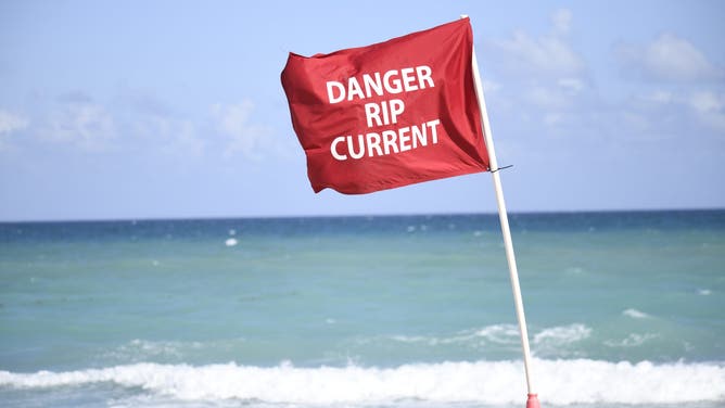 FORT LAUDERDALE, FL - FEBRUARY 15: A "Danger Rip Current" flag waves in the wind on February 15, 2026, at Fort Lauderdale Beach, in Fort Lauderdale, FL.