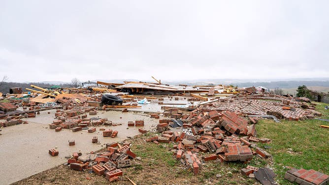 UNION CENTER, WISCONSIN - APRIL 15: Debris is scattered across the yard where a home once stood after a tornado on Tuesday near Raese Road on April 15, 2026 in Union Center, Wisconsin. 