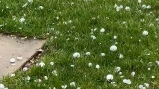 Golf ball-sized hail falls across Faribault, Minnesota Monday.
