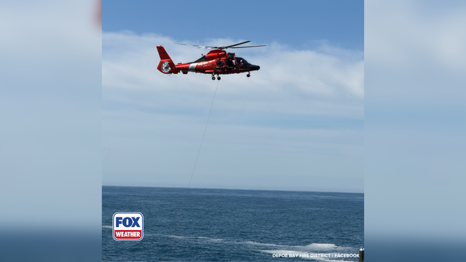 U.S. Coast Guard conduct a helicopter rescue for a stranded male.