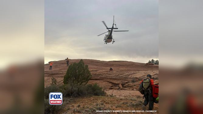 First responders perform a rescue after a hiker falls down a canyon.