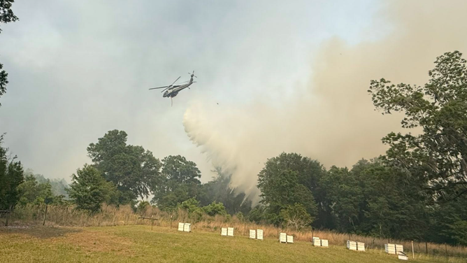 Wildfire burns in Putnam County, Florida on April, 20, 2026.