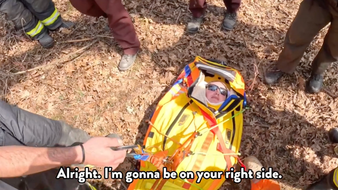 Medical personnel walk Schlag through the tactical rescue procedure.