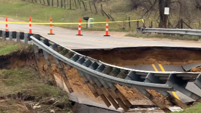 Traverse City, Michigan bridge washed out by floodwaters.