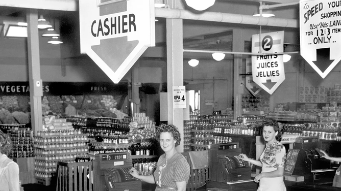 Women working at a grocery store in Oak Ridge, Tennessee, pose for a picture amid the Manhattan Project operations.