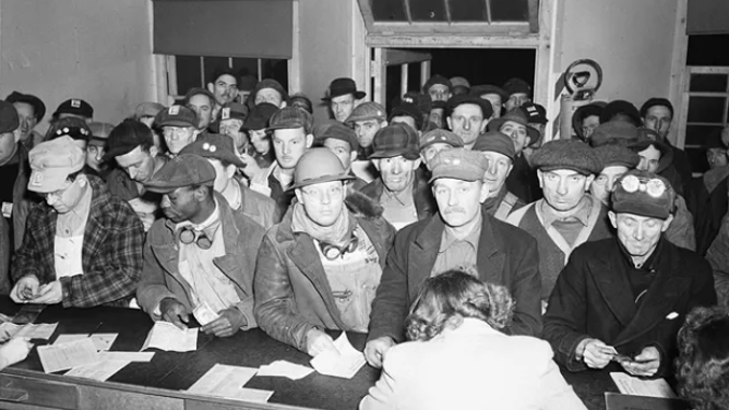 Workers form long lines on pay day at Hanford.